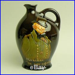A Royal Doulton Kingsware Pottery Mr Micawber The Ever Expectant Whiskey Jug